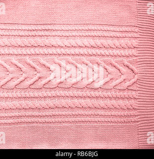 Pink Blush Terracotta Knitted pattern wool sweater texture close up. Handmade red knitting wool texture background Stock Photo