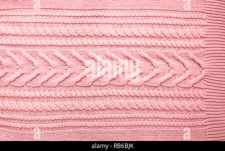 Pink Blush Terracotta Knitted pattern wool sweater texture close up. Handmade red knitting wool texture background Stock Photo