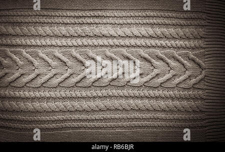 Grey Black Knitted pattern wool sweater texture close up. Handmade grey knitting wool texture background Stock Photo