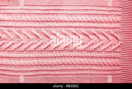 Pink Blush Terracotta Knitted pattern wool sweater texture close up. Handmade red knitting wool texture background Stock Photo