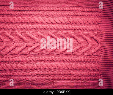Pink Blush Terracotta Knitted pattern wool sweater texture close up. Handmade red knitting wool texture background Stock Photo