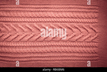 Pink Blush Terracotta Knitted pattern wool sweater texture close up. Handmade red knitting wool texture background Stock Photo