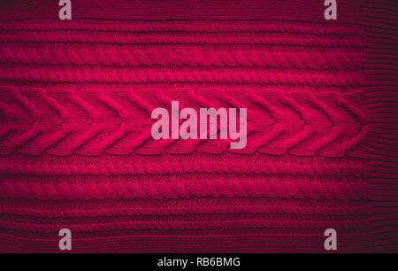 Pink purple magenta Knitted pattern wool sweater texture close up. Handmade pink purple magenta knitting wool texture background Stock Photo
