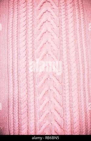 Pink Blush Terracotta Knitted pattern wool sweater texture close up. Handmade red knitting wool texture background Stock Photo