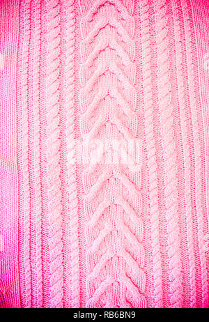 Pink Blush Terracotta Knitted pattern wool sweater texture close up. Handmade red knitting wool texture background Stock Photo