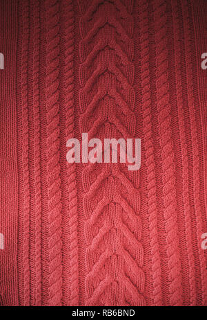 Pink Blush Terracotta Knitted pattern wool sweater texture close up. Handmade red knitting wool texture background Stock Photo