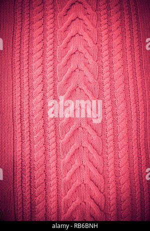 Pink Blush Terracotta Knitted pattern wool sweater texture close up. Handmade red knitting wool texture background Stock Photo