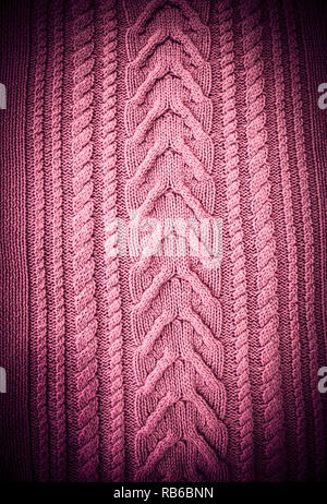 Pink Blush Terracotta Knitted pattern wool sweater texture close up. Handmade red knitting wool texture background Stock Photo