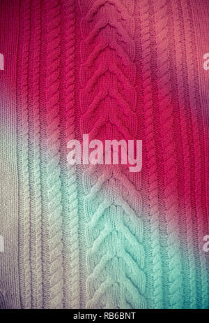 Pink Blue Magenta  Knitted pattern wool sweater texture close up. Handmade blue knitting wool texture background. Rainbow knitted pattern Stock Photo