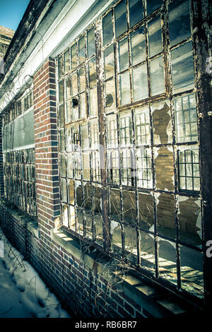 Abandoned building with broken glass windows Stock Photo - Alamy