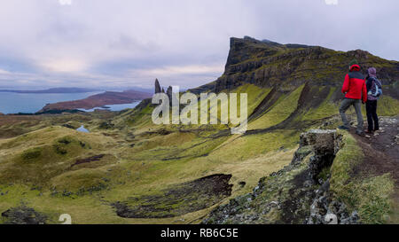 Couple in Rugged volcanic landscape at Old Man of Storr, Isle of Skye, Scotland Stock Photo