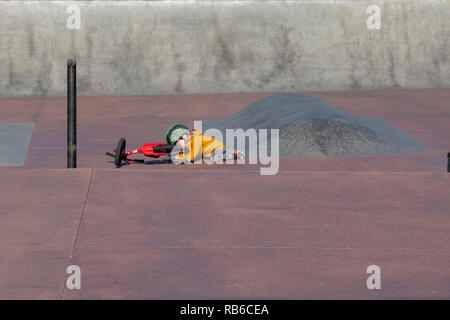 Denver, Colorado - Adam Hjermstad Jr., 4, crashes while riding his balance bike in a skatepark. Stock Photo