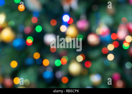 Out of focus fairy lights on a Christmas tree in England Stock Photo
