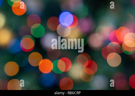 Out of focus fairy lights on a Christmas tree in England Stock Photo