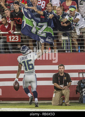 Seattle Seahawks wide receiver Tyler Lockett (16) is wrapped by Los Angeles  Rams Kickoff team during the first quarter at CenturyLink Field on October  7, 2018 in Seattle, Washington. The Rams beat