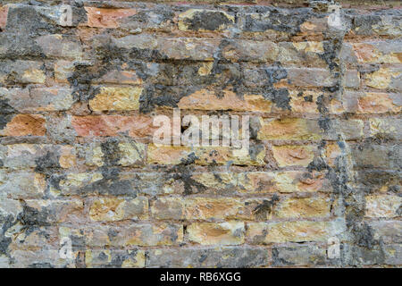 Red Brick  wall. Mediterranean style. Aged wall. Concrete and bricks. Stock Photo