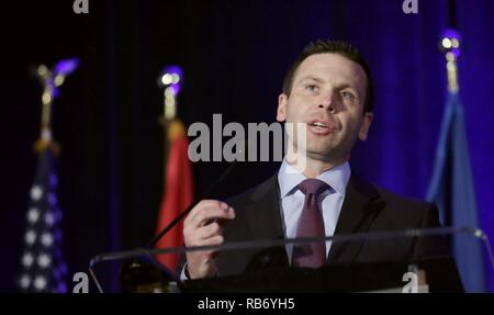 Historical photograph of CBP Commissioner Kevin K. McAleenan: U.S. Customs and Border Protection Deputy Commissioner Kevin K. McAleenan delivers the luncheon keynote at the 2016 East Coast Trade Symposium in Crystal City, Va., December 2, 2016. U.S. Customs and Border Protection Stock Photo