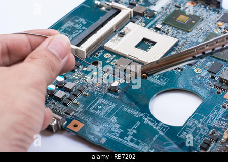 Repair of electronic devices, tin soldering parts Stock Photo
