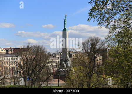 Bastejkalns ('Bastionsberget') is a park in Riga. In the distance the Freedom Monument - which is a memorial located in Riga, Latvia, honouring soldiers killed during the Latvian War of Independence (1918–1920). Stock Photo