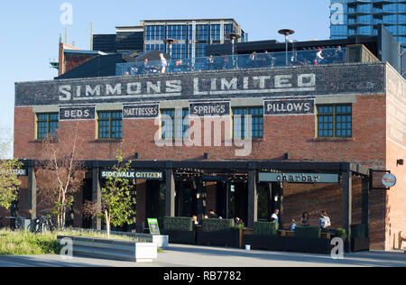 Simmons historic brick building in East Village. Built in 1912, it was originally a factory warehouse and is now a cafe, restaurant and bakery. Stock Photo