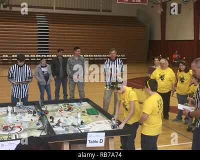 Sean O’Gorman and Jamison Norton (left to right at table), on the LegoTronics team from East Middle School, Tullahoma, prepare their team’s robot to complete a FIRST® LEGO® League (FLL) mission. Twenty-seven teams gathered at Tullahoma High School Dec. 17 to compete in the FLL Regional Qualifier Tournament. Stock Photo