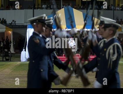 The U.S. Coast Guard Ceremonial Honor Guard perform Thursday, Dec. 1, 2016, for Britain's Prince Harry (background) and Barbados' Prime Minister Freundel Stuart during the 50th Anniversary of Emancipation celebrations at the Kensington Oval cricket ground in Bridgetown, Barbados. 20,000 people including Barbadian pop star Rihanna attended the celebration that marked 50 years of the island's independence from England. U.S. Coast Guard Stock Photo