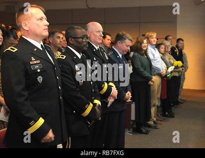 Col. Charles 'Chuck' Aris, 36th Infantry Division Assistant Division Commander of Support, Maj. Gen. Leslter Simpson, 36th Infantry Division Commanding General, Maj. General James K. 'Red' Brown, U.S. Forces Command Deputy Commanding General - Reserve Component, Maj. Gen. Jogn Nichols, Texas Military Department Adjutant General, stand for the invocation during the promotion of Aris from Col. to Brig. Gen. on Sunday, Dec. 4, 2016, at Camp Mabry, Austin, Texas. He is joined by family, friends and colleagues to celebrate his promotion at a ceremony and following reception at the Texas Military Fo Stock Photo