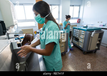 Nurse washing her hands at the hospital Stock Photo