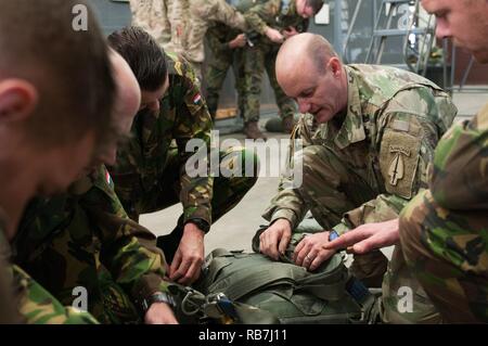 Army Master Sgt. James Roscoe representing Alpha Company, 5th Military Information Support Battalion, instructs soldiers from the Netherlands on the proper usage of MC6 and T11 equipment in preparation for Operation Toy Drop XIX. Operation Toy Drop is an annual collective training exercise used to prepare Soldiers to support the Global Combatant Commanders and Army Service Component Commanders in theaters of operation around the world. Stock Photo