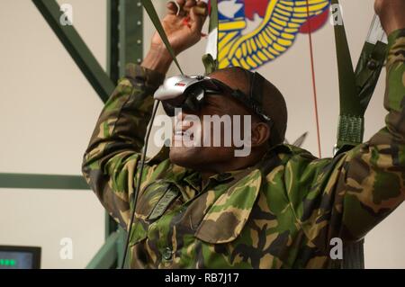 Sgt. Lentikile Dittale representing the Botswana Special Forces Regiment prepares to use the U.S. steering parachute simulator to familiarize himself before participating Operation Toy Drop XIX. Operation Toy Drop is an annual collective training exercise used to prepare Soldiers to support the Global Combatant Commanders and Army Service Component Commanders in theaters of operation around the world. Stock Photo