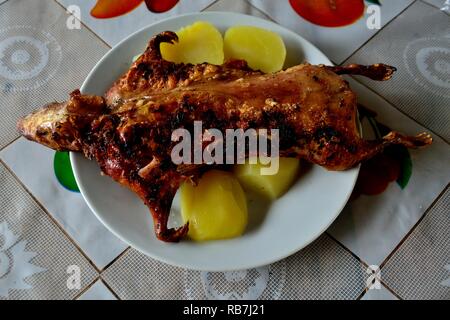 Grilled Cuy - Peasant community restaurant - National park HUASCARAN. Department of Ancash.PERU                    Stock Photo