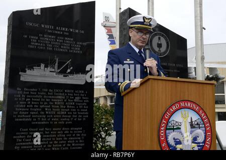 Lt. Cmdr. Matthew Meskun, the commanding officer of Coast Guard Marine Safety Unit Baton Rouge, speaks during the Coast Guard Cutter White Alder Memorial Service at the USS Kidd Veterans Museum in Baton Rouge, Louisiana, on December 7, 2016.  The event honored the 17 Coast Guard personnel who lost their lives when the cutter sank and was subsequently buried in the Mississippi River, December 7, 1968. Stock Photo