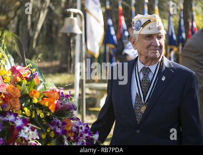 VIRGINIA BEACH, Va. (Dec. 7, 2016) Bill Muehleib, a veteran and Pearl Harbor survivor, is honored with a wreath during a ceremony commemorating the 75th anniversary of the attack on Pearl Harbor at Joint Expeditionary Base Little Creek-Fort Story. The ceremony honored the sacrifices of those who were present Dec. 7, 1941 and their family members. Stock Photo