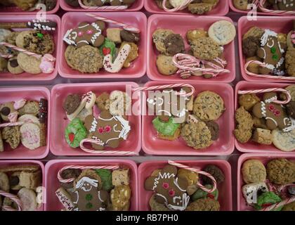 Cookies line tables at the officer’s club ballroom during the annual Cookie Caper event at Misawa Air Base, Japan, Dec. 7, 2016.  The 2016 Cookie Caper baked more than 21,000 cookies for unaccompanied service members throughout the base during the holiday season. Stock Photo