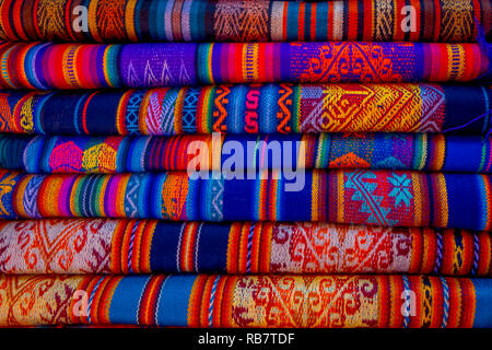 OTAVALO, ECUADOR, NOVEMBER 06, 2018: The typical andean fabrics sold on the handicrafts market of Otavalo, Ecuador Stock Photo