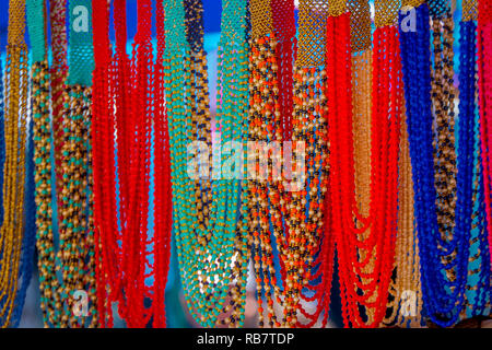 OTAVALO, ECUADOR, NOVEMBER 06, 2018: Outdoor view of colorful handmade handycrafts in a street market in Otavalo Stock Photo
