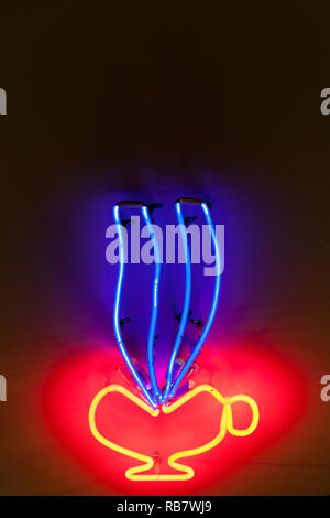 Neon sign in red, yellow, and blue, advertizing a coffee bar Stock Photo