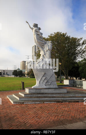 Monument to the Immigrant statue along the waterfront in downtown New Orleans created by Franco Alessandrini Stock Photo