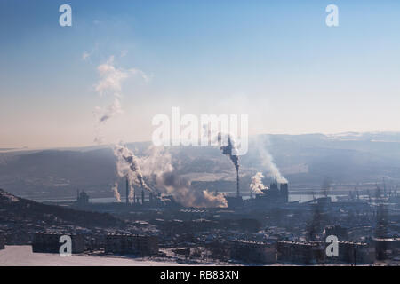 Chemical industry and working factory. Chimneys with smog in the sky. Air Pollution. Stock Photo