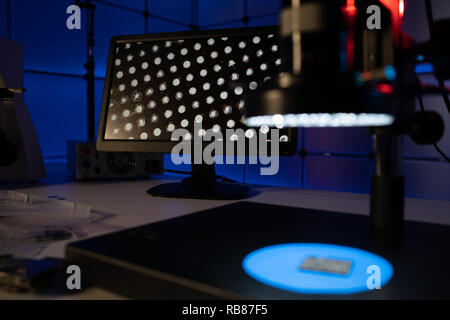 Laboratory of semiconductor chips. The development of modern electronics. crystal chip in the microscope Stock Photo