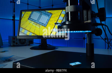 Laboratory of semiconductor chips. The development of modern electronics. crystal chip in the microscope Stock Photo