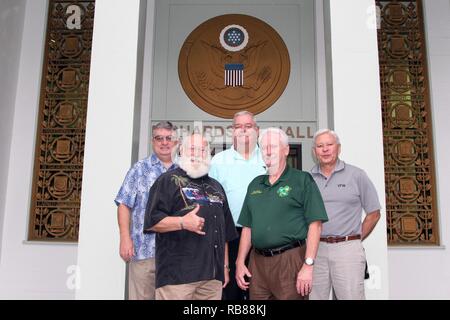 Veterans of Foreign Wars (VFW) staff members (from left to right), Brian J. Duffy, Commander-in-Chief, Jim Dyer, Chaplain, Hal Roesch, Inspector General, Carl J. Kaelin, National Chief of Staff, and Joseph E. Davis, Director of Public Affairs take time to visit historic Palm Circle and Richardson Hall at Fort Shafter, Hi during the Pearl Harbor 75th Anniversary Commemoration week on December 8, 2016. Stock Photo