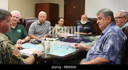 Veterans of Foreign Wars (VFW) staff members sit with Maj. Gen. O’Neil, U.S. Army Pacific (USARPAC) chief of staff during their visit to historic Palm Circle and USARPAC headquarters at Fort Shafter, Hi during the Pearl Harbor 75th Anniversary Commemoration week on December 8, 2016. Stock Photo