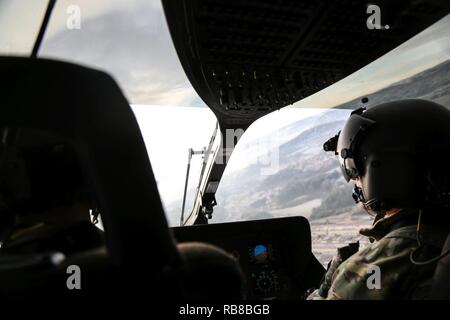 A soldier from the Falcon Observer Coach Trainer Team observes Volcano ...