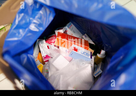 Pills and drugs in a blue trash bag. France. Stock Photo
