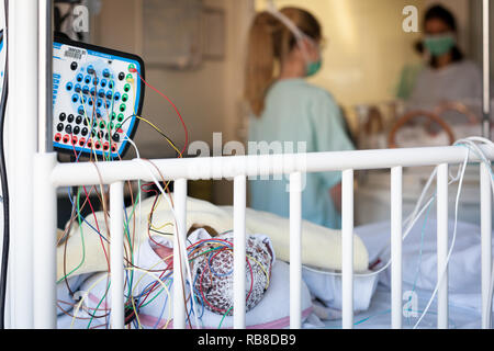 A nursery nurse takes care of a premature baby in the neonatalogy department. Hospital. Aix en Provence. Stock Photo