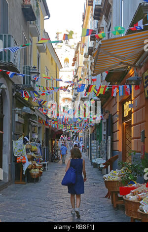 SORRENTO, ITALY - JUNE 26, 2014: Narrow Street With Flags Decoration in Sorrento, Italy. Stock Photo