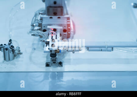 robotic pneumatic piston sucker unit on industrial machine,automation compressed air factory production Stock Photo