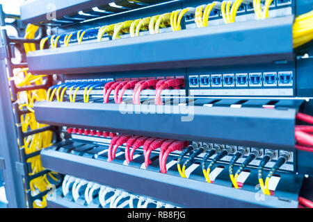 network cable connecting on network core switch close up Stock Photo