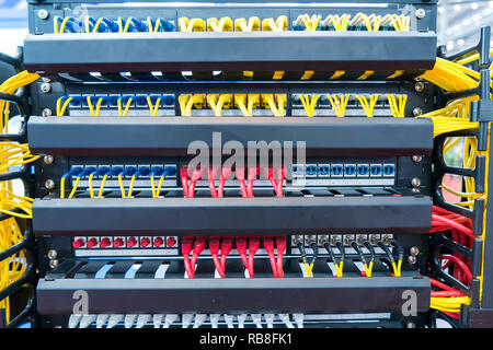network cable connecting on network core switch close up Stock Photo